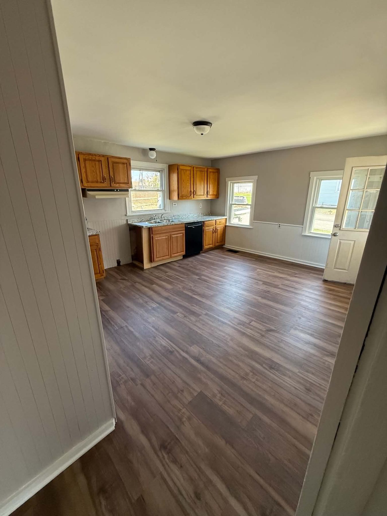 Finished kitchen with new flooring and clean wall finish